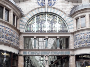 The grand entrance to Royal Arcade. This is a big open archway with curved glass work and an Art Nouveau style. 